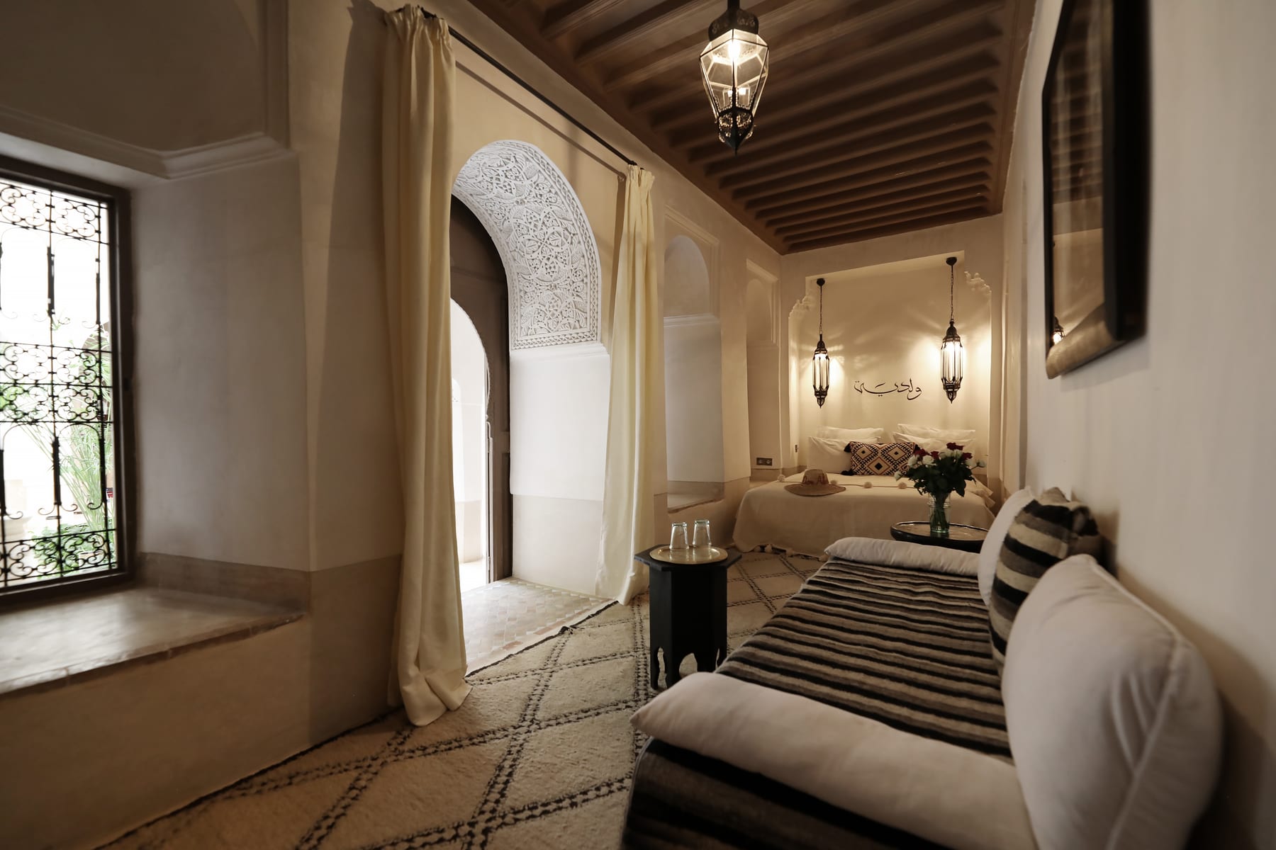The Oualidia room with its bed, daybed and carved courtyard arch
