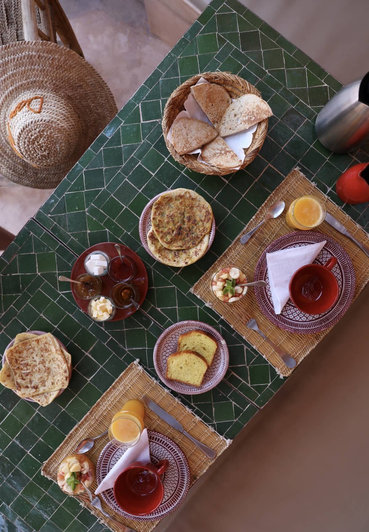 A breakfast table for two beside the zellige tiles at Dar Akal